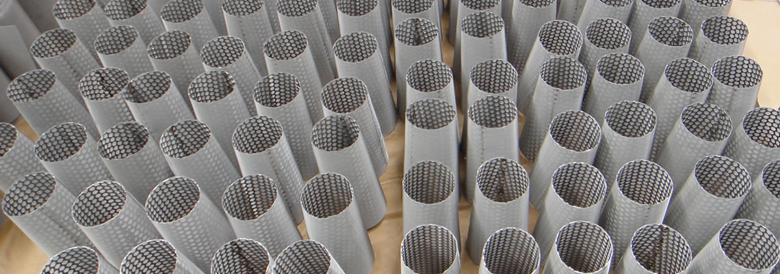 Sintered metal mesh filters supported by perforated tubes.